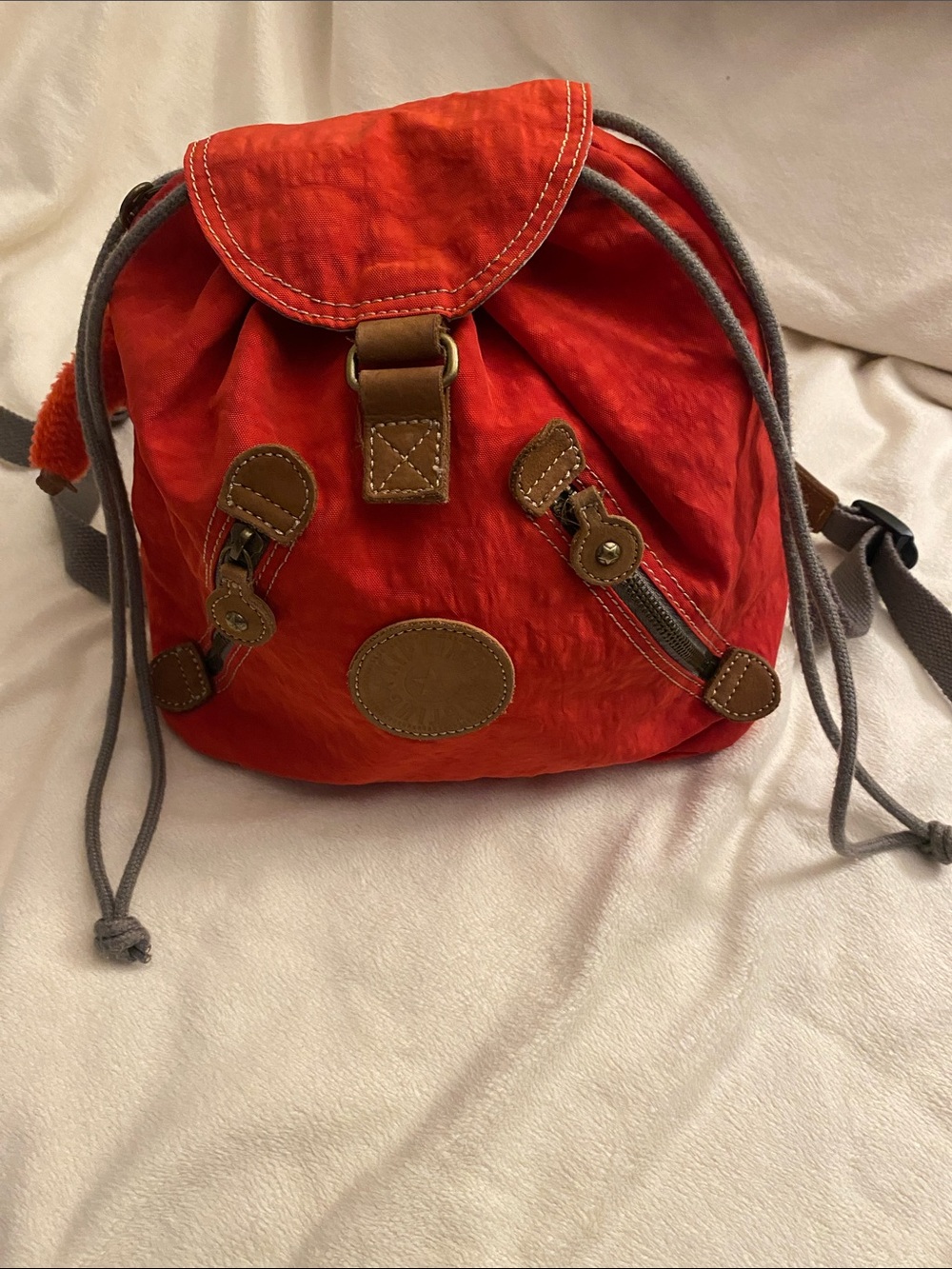 Kipling Red Drawstring Backpack with Brown Trim